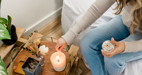 lighting candle in the bedroom